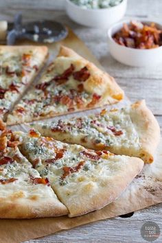 a pizza sitting on top of a wooden cutting board