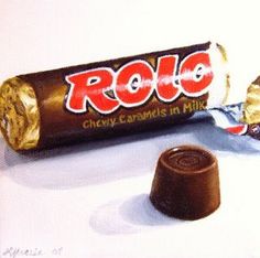 a chocolate bar with the word rolo written on it next to a piece of candy