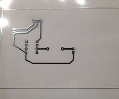 an image of a circuit board with wires attached to it