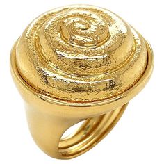 18k yellow gold sparkles with brilliancy in this ring. The bezel is a raised coil, inspired by the shell of a snail. The spiral is textured for a lustrous glow, while the groove itself is polished to match the band of the ring. Measurements for the ring are 0.92 inches (width) by 1.15 inches (length) by 0.9 inches (depth). Spiral Shell, The Spiral, Domed Ring, Gold Sparkle, Gold Texture, Jewelry Rings, Shells, Sparkle, Yellow Gold