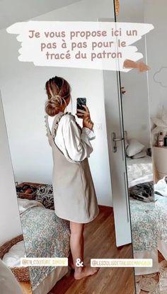 a woman taking a selfie in front of a mirror