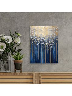 a painting on the wall next to flowers and vases