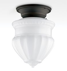 a ceiling light with a white glass shade on it's top and black trim