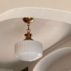 a light fixture hanging from the ceiling in a room