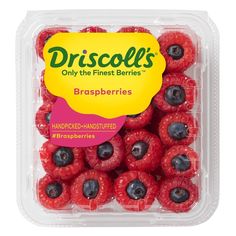 a plastic container filled with raspberries and blueberries