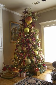 a decorated christmas tree in a living room