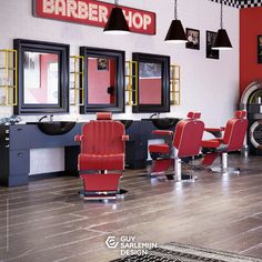 the interior of a barber shop with red chairs