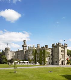 an old castle is shown on a sunny day