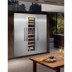 a wine cooler in the middle of a kitchen