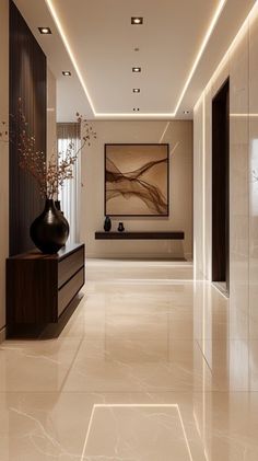 an elegant hallway with white marble flooring and large black vase on the end table