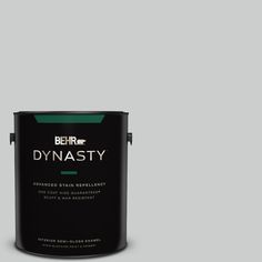 a black paint can with the words dynastiy on it's side