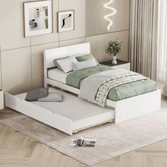 a white bed sitting on top of a wooden floor