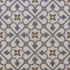 an artistic tile design in blue and white with gold accents on the edges, including hearts