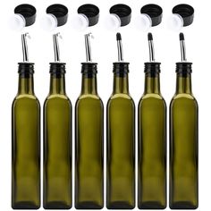 six empty wine bottles with black caps