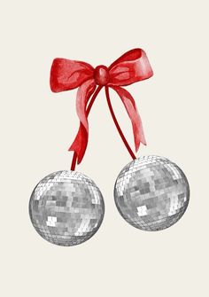 two silver disco balls with a red bow hanging from it's side on a white background