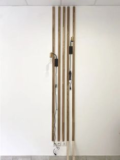 two wooden poles with wires attached to them