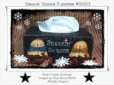 an image of a tissue box with two candles and snowflakes