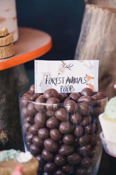 a glass bowl filled with lots of chocolate candies