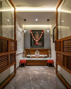 the interior of a home with wooden shutters and stone flooring, along with an ornate painting on the wall