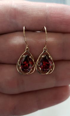 Want to see more photos and videos of my jewelry and how its made? Follow us on Instagram instagram.com/elizabethjewelryinc @elizabethjewelryinc Follow us on Facebook Facebook.com/Elizabethjewelryinc This is a beautiful pear teardrop design earrings that is handmade brand new. It is set in real Solid 14Kt Gold. You can choose if you want 14Kt White Gold, 14Kt Yellow Gold or 14Kt Rose Gold. I have these earrings available with all gemstones that you can see in my store. This is the perfect gift f Burgundy Dress Accessories Jewelry, Gold Jewel Earrings, Gold And Garnet Jewelry, Gold And Ruby Jewelry, Garnet Earrings Gold, Red Gold Earrings, Red And Gold Jewelry Aesthetic, Jewelry For Red Dress, Red And Gold Earrings