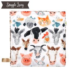 a small square with farm animals on it and the words, snuggle lacy