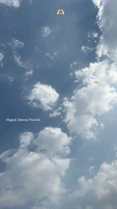 there is a kite flying high in the sky with clouds behind it and an ad for moguli international