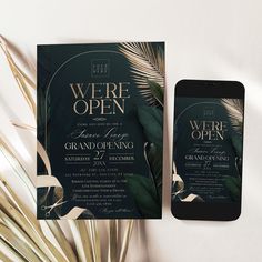 an elegant wedding suite with palm leaves and greenery is displayed next to the phone