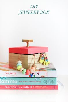 three books stacked on top of each other with the title diy jewelry box written above them