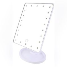 a white lighted vanity mirror on a stand