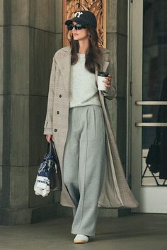 From WFH looks to street style, we're completely obsessed with the vibes of the Lulus Poised Coziness Heather Grey Pintuck Wide-Leg Sweatpant Trousers! Soft heathered sweater knit fabric shapes these versatile, sweatpants-style trousers that have a high waist and a hidden zip fly with a top clasp closure. Wide legs boast stylish pintuck details, pleated accents, and side seam pockets, ending at ankle-length hems. Elastic at back for fit. Fit: This garment fits true to size. Length: Floor length. Sweatpants Cute Outfits, Gray Wide Leg Sweatpants Outfit, Grey Trousers Outfit Winter, Grey Office Pants Outfit, Grey Wide Leg Sweatpants Outfit, Winter Smart Casual Women, Wide Leg Trousers Outfit Work, Trousers Outfit Work, Casual Trousers Outfit