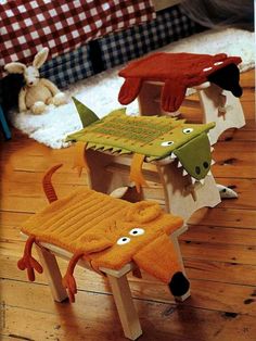 three children's wooden benches with stuffed animals on them and one child's foot resting on the bench