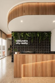 the reception area is decorated with wood and plants