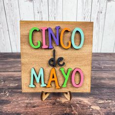 the word cinco de mayo spelled with wooden letters