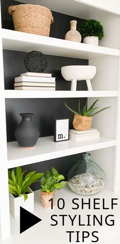 white shelves with plants and vases on them