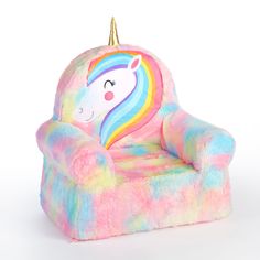 a plush chair with a rainbow colored unicorn on the front and back, as well as a gold horn