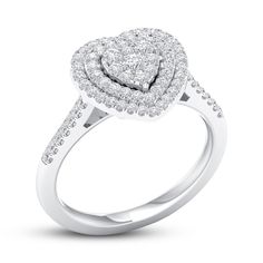 a heart shaped diamond ring on a white background