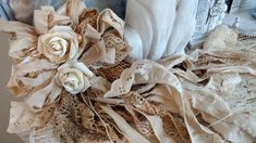 a bouquet of fabric and flowers sitting on top of a table