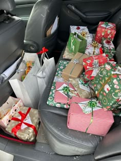 the back seat of a car filled with presents