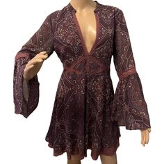 Free People Bell Sleeves Mini Dress - New Without Tag. Get In Bohemian-Chic Spirit With This Flowy Dress Featuring Intricate Print Patterns And Cotton Crocheted Lace Trim Celebrating Free-Spirited Fashion. Crafted From High-Quality Materials That Feel Like A Dream Against The Skin, Ensuring All-Day Comfort And Effortless Movement. Deep Burgundy Color, Long Fluted Sleeves And Lace Hemmed Cotton Underskirt Add A Touch Of Drama And Romance. Smocked Elastic Waist On The Back Offers A Tailored Fit Wi Fluted Sleeves, Crocheted Lace, Crochet Lace Trim, Deep Burgundy, Lace Hem, Cotton Crochet, Free Spirited, Flowy Dress, Bohemian Chic