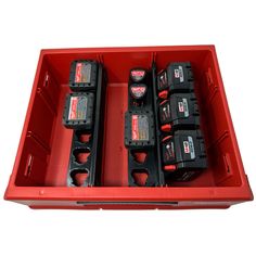 a red box filled with lots of black and red batteries