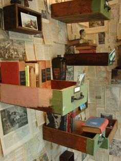 several books are stacked on shelves in a room