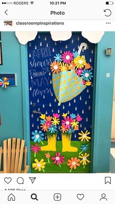 a door decorated with flowers and umbrellas for the springtime break - up party