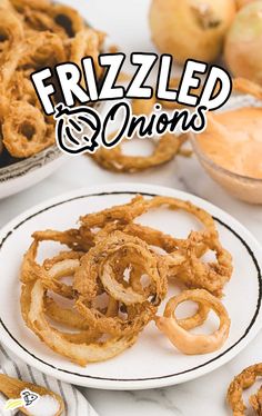 fried onion rings on a white plate next to apples and other food items with the title frizzled onions