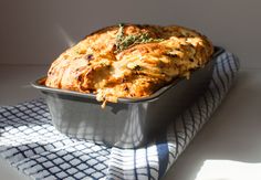 a casserole dish on a blue and white towel