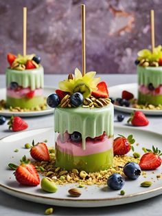 three desserts on plates with strawberries, blueberries and other fruit toppings