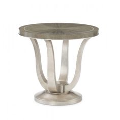 a round table with metal legs and a wooden top