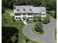 an aerial view of a large white house