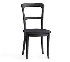 a black chair sitting next to a white wall with the seat up and bottom down