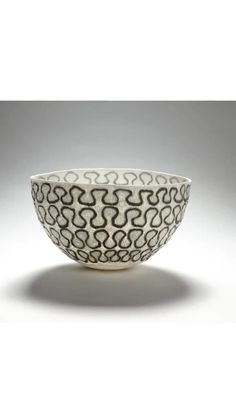 a black and white bowl with wavy designs