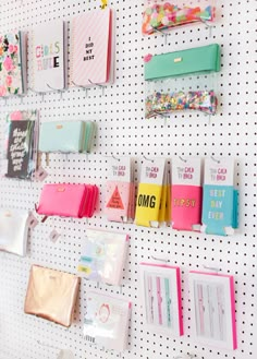 a pegboard with many different types of items hanging on it's side wall